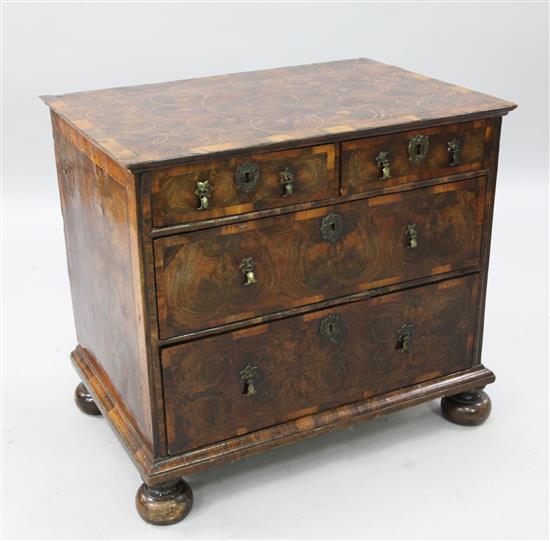 A William & Mary oyster veneered chest, W.2ft 8in. D.1ft 10in. H.2ft 4in.